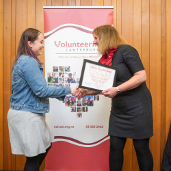 Thalia Rae, from Student Volunteer Army, receiving an Award