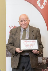 Barry Doherty, from English Language Partners, with his Award