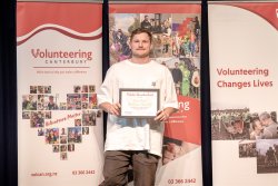 Jeremy Benton, Motor Neurone Disease NZ, with his Award