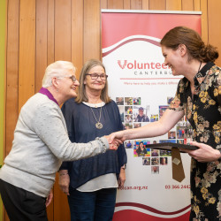 Cantabrainers Volunteer Group, from Cantabrainers Therapeutic Choir, receiving their Award