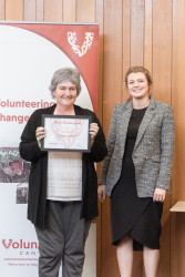 Dot Volovik, from Cancer Society CWC Division, with her award