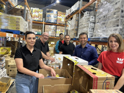 Staff members from Westpac volunteering at Christchurch City Mission, packing food parcels