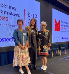 Volunteering Canterbury General Manager, Glenda Martin, and Board Members Vanessa Simpson and Rae Wakefield-Jones, standing in front of the stage