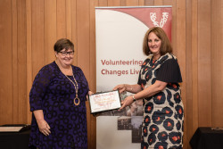 Erin Manning, from Perinatal Wellbeing Canterbury, receiving her Award on stage