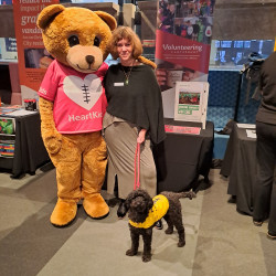 Glenda Martin, her service dog Kobe, and Maia the Heart Kids Bear Mascot, at the Student Volunteer Expo