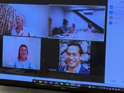 A screenshot showing a Zoom meeting, with four participants