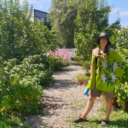 A woman standing outdoors in the Otakaro Orchard