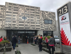 A group of people standing outside the building of the new Christchurch Community House