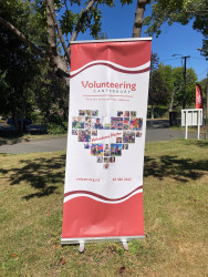 The Volunteering Canterbury banner, displayed in a park