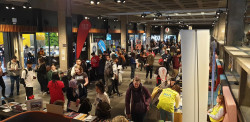 A large open room, crowded with people