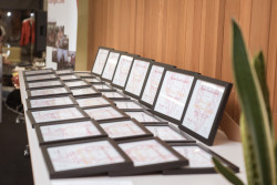 A display of framed certificates on a table