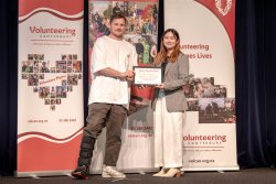 Jeremy Benton, Motor Neurone Disease NZ, with his Award