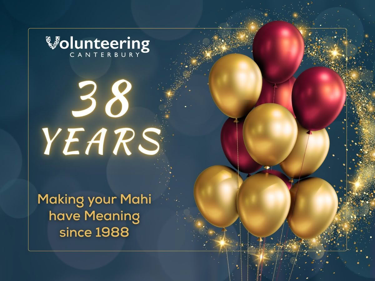 A 38th anniversary graphic for Volunteering Canterbury, featuring gold and burgundy balloons surrounded by sparkling golden accents on a dark blue background. The graphic highlights “38 YEARS” and the message “Making your Mahi have Meaning since 1988”.