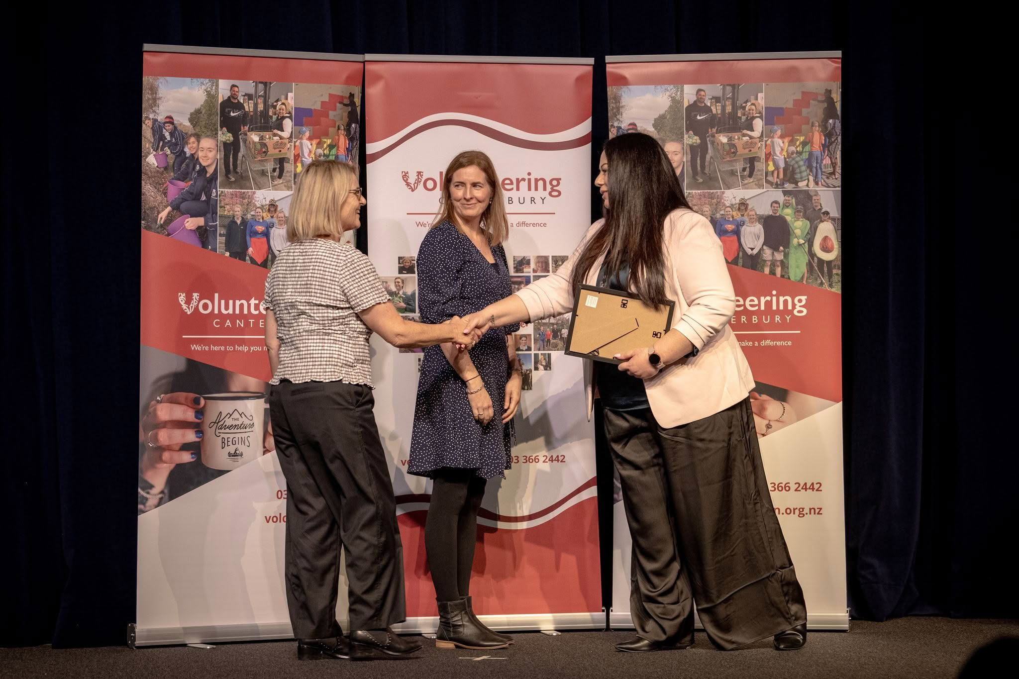 Sorting and Packing Leaders, Clothed in Love, receiving a Volunteer Recognition Award at the 2026 ceremony.