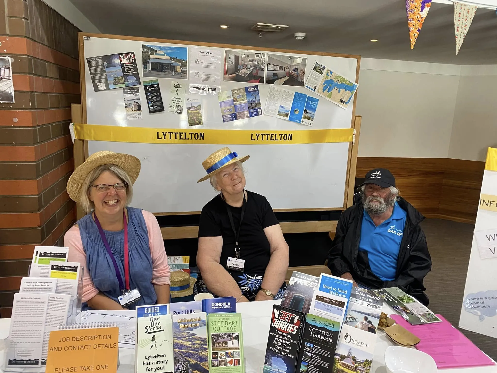 A team from Lyttelton Harbour Information Centre at their stall